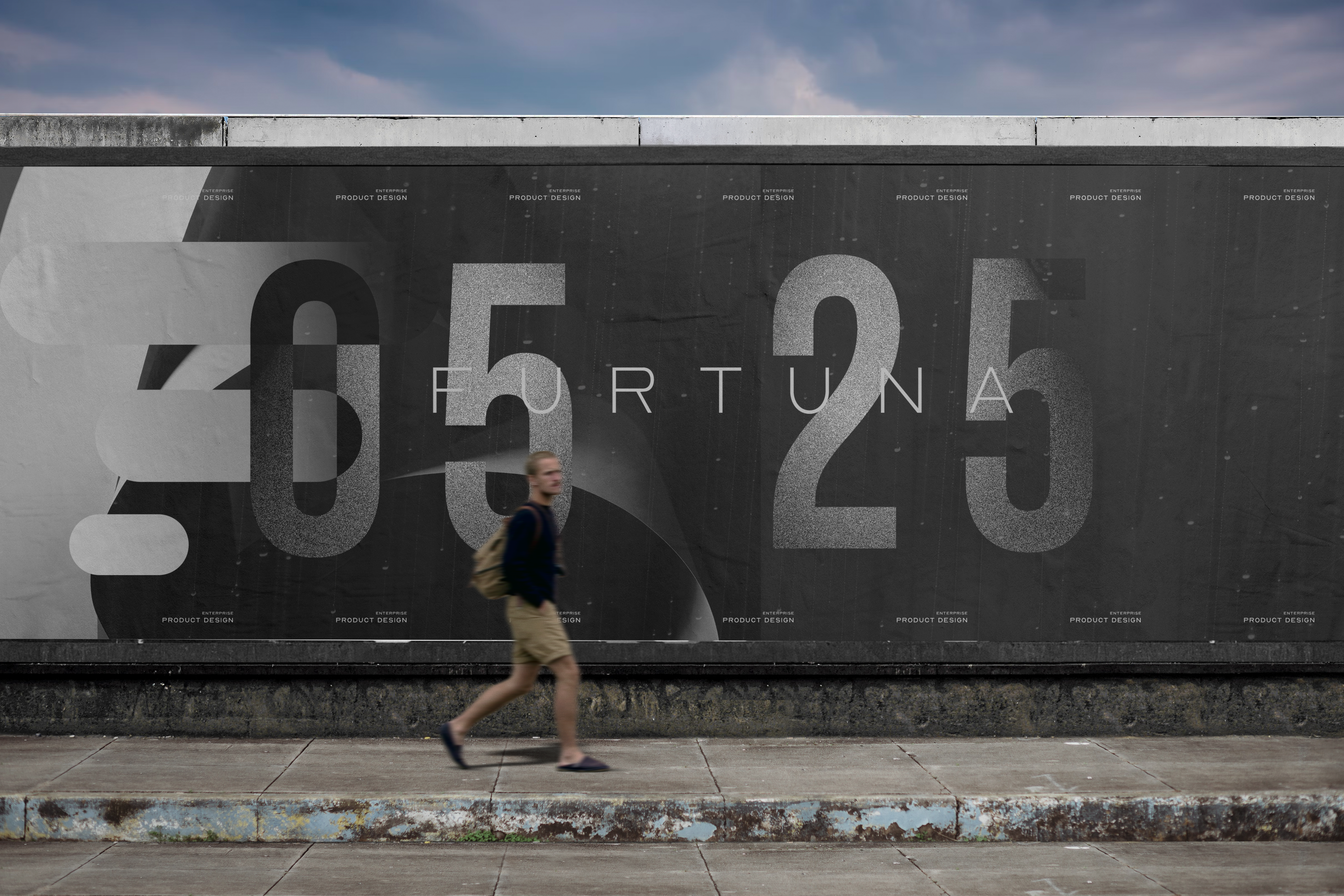 Man walking by a billboard.
